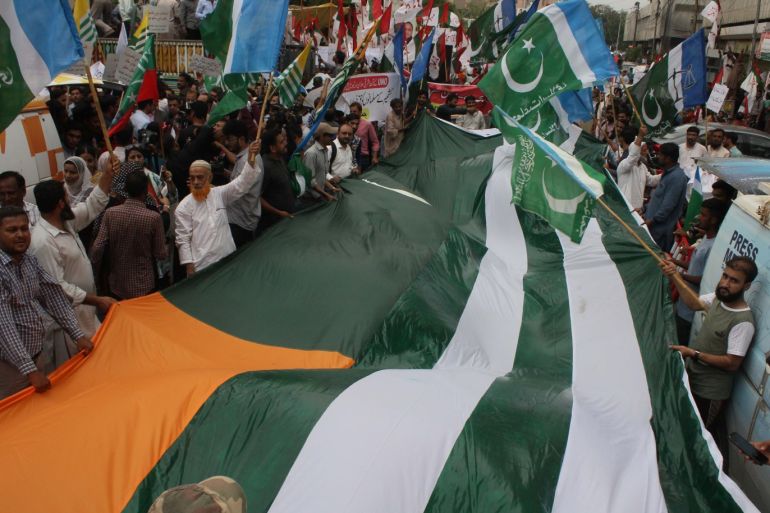 Pakistani people rally to mark Kashmir Solidarity against Indian forces- - KARACHI, PAKISTAN - AUGUST 05: Pakistani people rally to mark Kashmir Solidarity against Indian forces in Karachi, Pakistan on August 5, 2019. The Indian government imposed a security lockdown on the Indian-administered part of Kashmir in the early hours of Monday after deploying tens of thousands of troops in the past week, claiming there was a terror threat.
