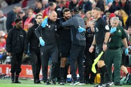 LIVERPOOL, ENGLAND - AUGUST 09: Alisson Becker of Liverpool leaves the pitch following an injury during the Premier League match between Liverpool FC and Norwich City at Anfield on August 09, 2019 in Liverpool, United Kingdom. (Photo by Michael Regan/Getty Images)