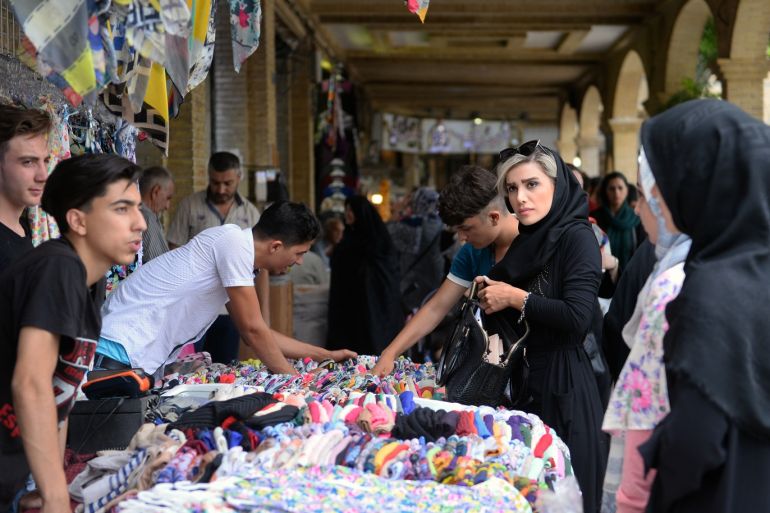 Daily life in Tehran - - TEHRAN, IRAN - JULY 10: Women view clothing for sale at the Grand Bazaar in Tehran, Iran on July 10, 2019.