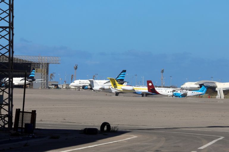 Airplanes are seen at Mitiga airport, after an air strike in Tripoli, Libya April 8, 2019. REUTERS/Hani Amara