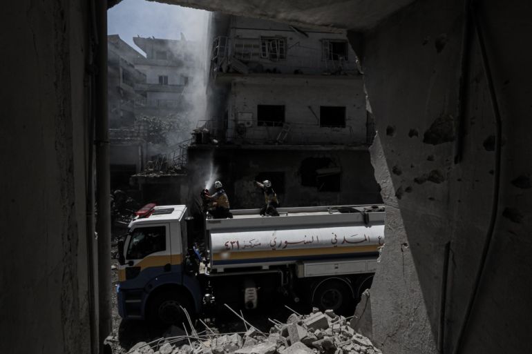 Regime attacks kill 6 in Syria’s de-escalation zone- - IDLIB, SYRIA - JULY 28: Firefighters try to extinguish the fire after Assad Regime warplanes carried out airstrikes on the town of Arihah in Idlib province, Syria on July 28, 2019. At least six civilians were killed and 18 others injured in regime attacks in de-escalation zone in northwestern Syria.