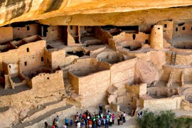 MESA VERDE, COLORADO, JUNE 7, 2014: A Ranger leads a group of visitors through the Cliff Palace at M