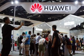 People look at products at the Huawei stall at the International Consumer Electronics Expo in Beijing, China August 2, 2019. REUTERS/Thomas Peter