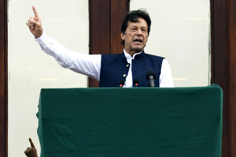 epa07803654 Imran Khan, Pakistan's Prime Minister stands outside his office as the country observes 'Kashmir Hour', from 12:00 pm to 12:30 pm to express solidarity with Kashmiris in Indian administered Kashmir, in Islamabad Pakistan, 30 August...