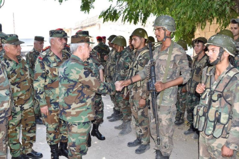 General Ali Abdullah Ayyoub, Syria's Defense Minister visits army soldiers in al-Hobeit in Idlib province, Syria in this handout released by SANA on August 11, 2019. SANA/Handout via REUTERS ATTENTION EDITORS - THIS IMAGE WAS PROVIDED BY A THIRD PARTY. REUTERS IS UNABLE TO INDEPENDENTLY VERIFY THIS IMAGE.