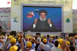 Lebanon's Hezbollah leader Sayyed Hassan Nasrallah gestures as he addresses his supporters via a screen during a rally marking the anniversary of the defeat of militants near the Lebanese-Syrian border, in al-Ain village, Lebanon August 25, 2019. REUTERS/Aziz Taher