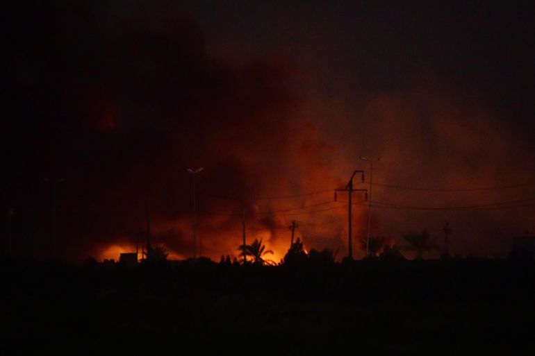 epa07770477 A view of the explosion of a weapon stash belonging to the Sayid al-Shuhadaa combat division part of al-Hashd al-Shaabi (Popular Mobilization Forces), near Baghdad, Iraq, on 12 August 2019. According to Iraq's interior ministry the cause of the explosion has not yet been determined and 13 people were injured. EPA-EFE/MURTAJA LATEEF