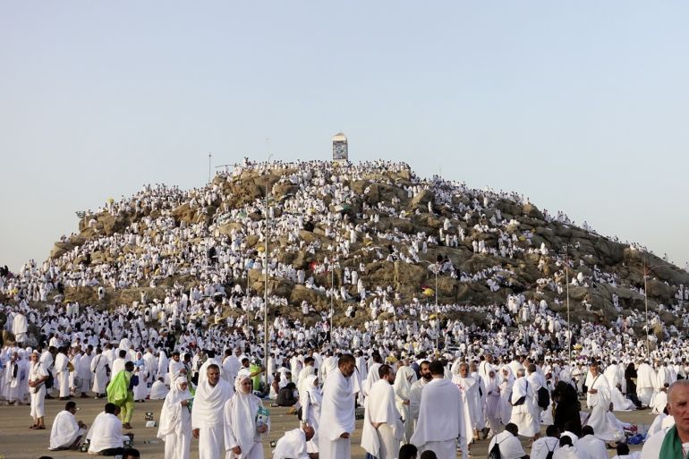 Muslim prospective pilgrims visit Jabal ar-Rahmah- - MECCA, SAUDI ARABIA - AUGUST 10: Muslim prospective pilgrims visit the Mount of Mercy (Jabal ar-Rahmah) in Mecca, Saudi Arabia on August 10, 2019. Muslim pilgrims, dressed in white, reach Mount Arafat also known as Mount of Mercy (Jabal ar-Rahmah), in western Saudi Arabia, and take part in the main rituals of the annual hajj in order to become pilgrims on the eve of Eid al-Adha (Feast of Sacrifice). Muslims visit the place where Adam and Hawa reunited on Earth after falling from Heaven, and where Adam was forgiven, hence it is known as the