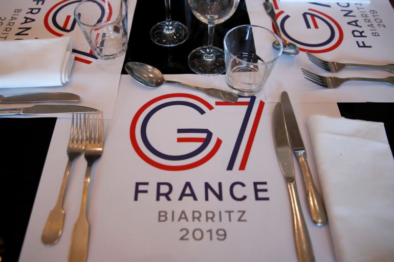 G7 summit in Biarritz A G7 table set is pictured in the press center during the G7 summit in Biarritz, France, August 24, 2019. REUTERS/Christian Hartmann