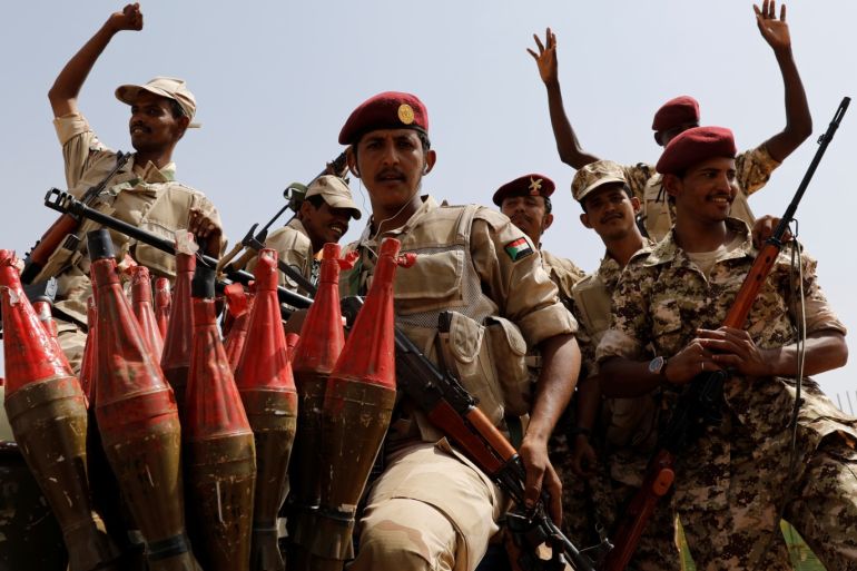 Sudan's paramilitary Rapid Support Forces (RSF) soldiers greet people as they secure a site where Lieutenant General Mohamed Hamdan Dagalo, deputy head of the military council and head of RSF, attends a meeting in Khartoum, Sudan, June 18, 2019. REUTERS/Umit Bektas