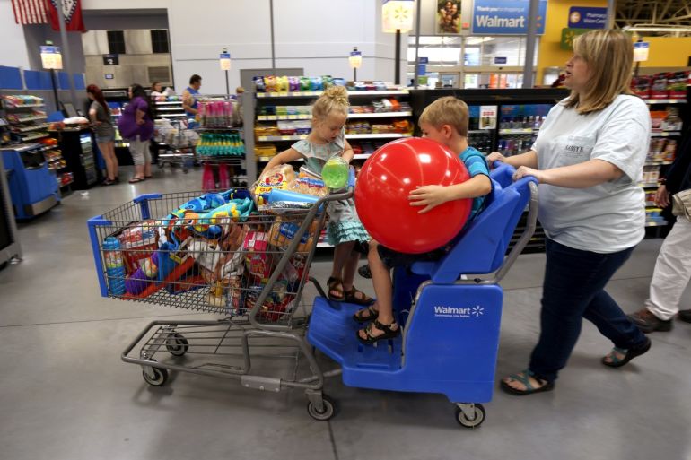 A family shops at the Wal-Mart Supercenter in Springdale, Arkansas June 4, 2015. REUTERS/Rick Wilking/File Photo GLOBAL BUSINESS WEEK AHEAD PACKAGE - SEARCH BUSINESS WEEK AHEAD SEPTEMBER 26 FOR ALL IMAGES