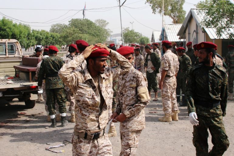 ATTENTION EDITORS - SENSITIVE MATERIAL. THIS IMAGE MAY OFFEND OR DISTURB Soldiers react after a missile attack on a military parade during a graduation ceremony for newly recruited troopers in Aden, Yemen August 1, 2019. REUTERS/Fawaz Salman