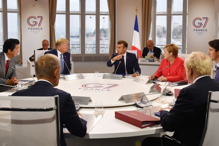 BIARRITZ, FRANCE - AUGUST 25: Canada's Prime Minister Justin Trudeau, Britain's Prime Minister Boris Johnson, Germany's Chancellor Angela Merkel, European Council President Donald Tusk, France's President Emmanuel Macron, Japan's Prime Minister Shinzo Abe and US President Donald Trump meet for the first working session of the G7 Summit on August 25, 2019 in Biarritz, France. The French southwestern seaside resort of Biarritz is hosting the 45th G7 summit from August 24 to 26. High on the agenda will be the climate emergency, the US-China trade war, Britain's departure from the EU, and emergency talks on the Amazon wildfire crisis. (Photo by Jeff J Mitchell - Pool /Getty Images)