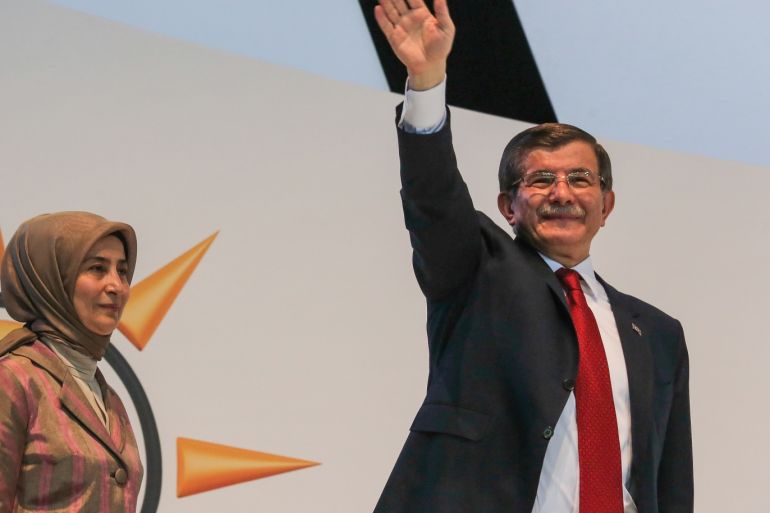 ANKARA, TURKEY - MAY 22: Turkey's outgoing Prime Minister Ahmet Davutoglu (R) and his wife Sare Davutoglu waves to the supporters during the Extraordinary Congress of the ruling AK Party (AKP) to choose the new leader of the party on May 22, 2016 in Ankara, Turkey. Turkey's Transport and Communication Minister Binali Yildirim is the sole candidate to head AK Party and as the new Prime Minister of Turkey. (Photo by Gokhan Tan/Getty Images)
