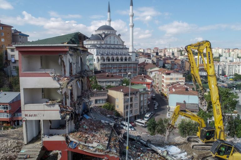 Aftermath of the 5.8-magnitude earthquake in Istanbul- - ISTANBUL, TURKEY - SEPTEMBER 27: A heavy duty machine demolishes a 5-storey building following the 5.8-magnitude earthquake in Istanbul, Turkey on September 27, 2019.
