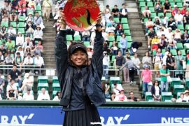 OSAKA, JAPAN - SEPTEMBER 22: Singles champion Naomi Osaka of Japan poses for photographs with the trophy after the Singles final agains Anastasia Pavlyuchenkova of Russia during day seven of the Toray Pan Pacific Open at Utsubo Tennis Cent on September 22, 2019 in Osaka, Japan. (Photo by Koji Watanabe/Getty Images)