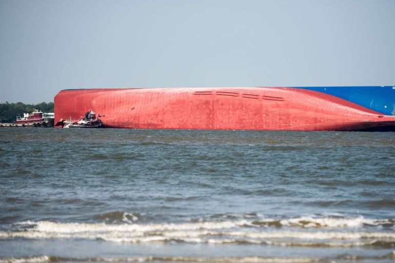 ST SIMONS ISLAND, GA - SEPTEMBER 09: Emergency responders work to rescue crew members from a capsized cargo ship on September 9, 2019 in St Simons Island, Georgia. A 656-foot vehicle carrier, the M/V Golden Ray departed the Brunswick port on Sunday and suffered a fire on board, capsizing in St. Simons Sound. Sean Rayford/Getty Images/AFP== FOR NEWSPAPERS, INTERNET, TELCOS & TELEVISION USE ONLY ==
