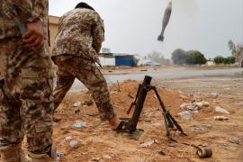 A fighter loyal to Libya's U.N.-backed government (GNA) fires a mortar during clashes with forces loyal to Khalifa Haftar on the outskirts of Tripoli, Libya May 25 2019 REUTERS Goran Tomasevic.png