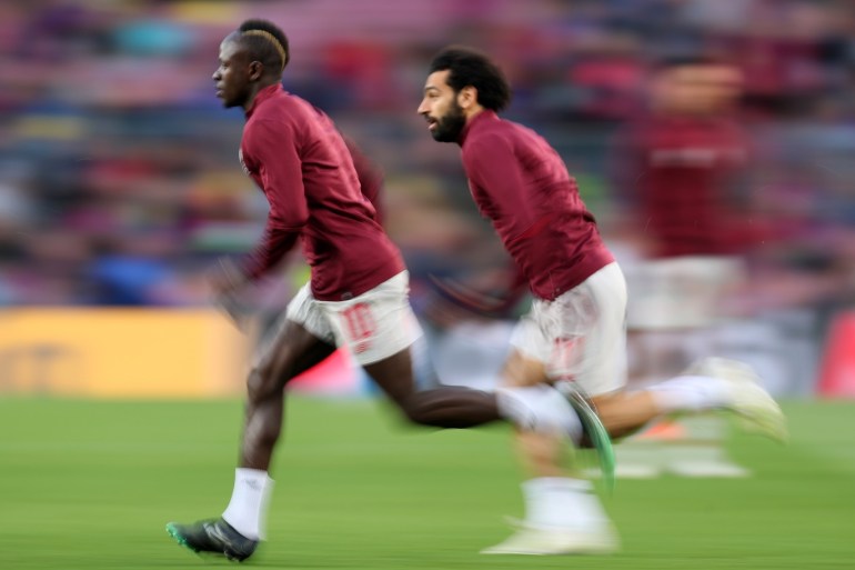BARCELONA, SPAIN - MAY 01: Sadio Mane of Liverpool and Mohamed Salah of Liverpool warm up ahead of the UEFA Champions League Semi Final first leg match between Barcelona and Liverpool at the Nou Camp on May 01, 2019 in Barcelona, Spain. (Photo by Catherine Ivill/Getty Images)