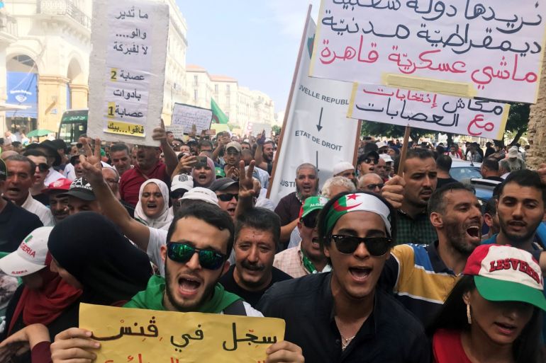 Demonstrators shout slogans and carry banners during a protest demanding the removal of the ruling elite in Algiers, Algeria September 10, 2019. REUTERS/Abdelaziz Boumzar