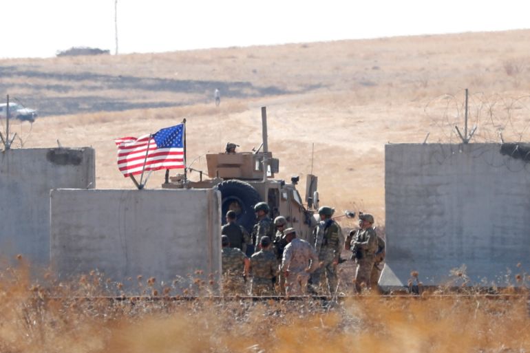 Turkish and U.S. soldiers meet on the Turkish-Syrian border before a joint U.S.-Turkey patrol, as it is pictured from near the Turkish town of Akcakale, Turkey, September 8, 2019. REUTERS/Murad Sezer