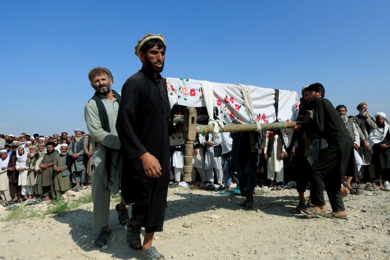 Men carry a coffin of one of the victims after a drone strike, in Khogyani district of Nangarhar province, Afghanistan September 19, 2019.REUTERS/Parwiz