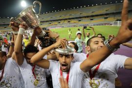 Football Soccer - Egyptian Cup Final - Smouha v Zamalek - Borg El Arab Stadium, Alexandria, Egypt - May 15, 2018 Zamalek players celebrate with the trophy after winning the Egyptian Cup REUTERS/Mohamed Abd El Ghany