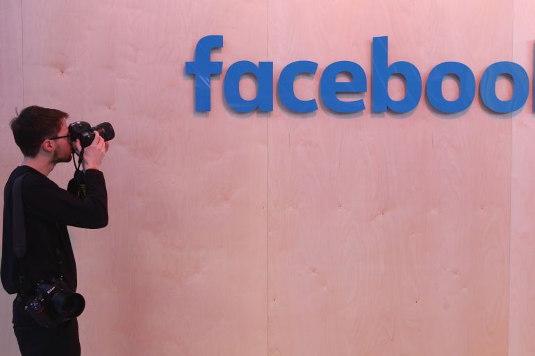 BERLIN, GERMANY - FEBRUARY 24: A photographer snaps a photo of the Facebook logo at the Facebook Innovation Hub on February 24, 2016 in Berlin, Germany. The Facebook Innovation Hub is a temporary exhibition space where the company is showcasing some of its newest technologies and projects. (Photo by Sean Gallup/Getty Images)