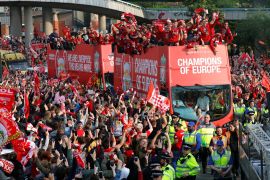Soccer Football - Champions League - Liverpool victory parade - Liverpool, Britain - June 2, 2019 Liverpool's team bus travels past fans during the parade REUTERS/Phil Noble