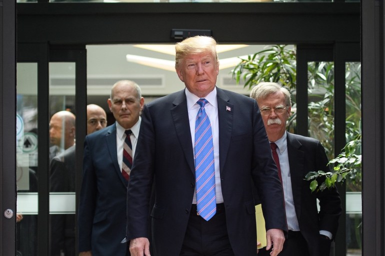 LA MALBAIE , QC - JUNE 09: US President Donald Trump (C) leaves with Chief of Staff John Kelly (L) and National Security Advisor John Bolton (R) after holding a press conference ahead of his early departure from the G7 Summit on June 9, 2018 in La Malbaie, Canada. Canada are hosting the leaders of the UK, Italy, the US, France, Germany and Japan for the two day summit, in the town of La Malbaie. Leon Neal/Getty Images/AFP== FOR NEWSPAPERS, INTERNET, TELCOS & TELEVISION USE ONLY ==