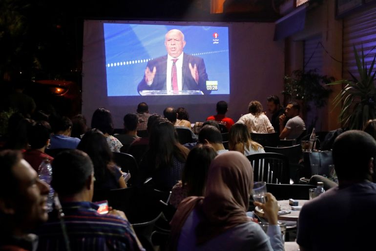 People watch a televised debate between presidential candidates at a cafe in central Tunis, Tunisia, September 7, 2019. REUTERS/Zoubeir Souissi