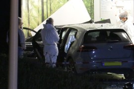 An expert looks at a car at the scene where former Dutch professional soccer player, who defended for English club Burton Albion and FC Volendam, Kelvin Maynard, was shot dead in Amsterdam, Netherlands September 18, 2019. Picture taken September 18, 2019. Inter Visual Studio via REUTERS TV. ATTENTION EDITORS - THIS IMAGE HAS BEEN SUPPLIED BY A THIRD PARTY. MANDATORY CREDIT