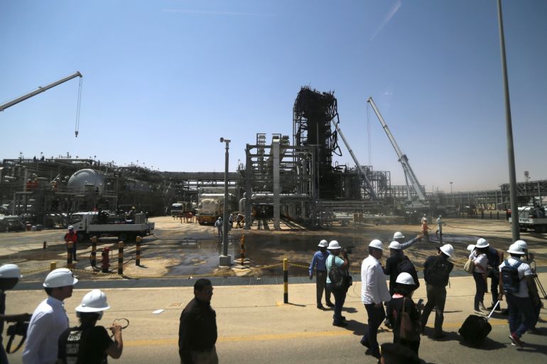 Members of the media are seen at the damaged site of Saudi Aramco oil facility in Khurais, Saudi Arabia, September 20, 2019. REUTERS/Hamad l Mohammed