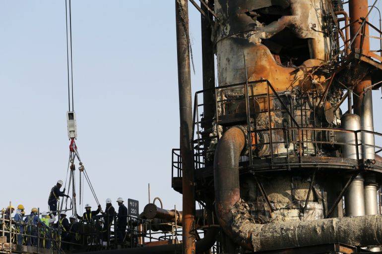 Workers are seen at the damaged site of Saudi Aramco oil facility in Abqaiq, Saudi Arabia, September 20, 2019. REUTERS/Hamad l Mohammed