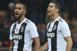 MILAN, ITALY - NOVEMBER 11: (L-R) Medhi Benatia and Cristiano Ronaldo of Juventus FC celebrate a victory at the end of the Serie A match between AC Milan and Juventus at Stadio Giuseppe Meazza on November 11, 2018 in Milan, Italy. (Photo by Marco Luzzani/Getty Images)
