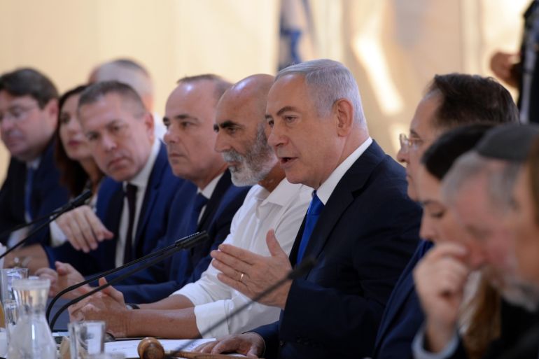Israeli PM reiterates pledge to annex Jordan valley- - WEST BANK - SEPTEMBER 15 : (----EDITORIAL USE ONLY – MANDATORY CREDIT - "HAIM ZACH / GPO / HANDOUT" - NO MARKETING NO ADVERTISING CAMPAIGNS - DISTRIBUTED AS A SERVICE TO CLIENTS----) Israeli Prime Minister Benjamin Netanyahu (5th R) speaks during a cabinet meeting held in the Jordan valley, for the first time since Israel occupied the West Bank in 1967, in West Bank on September 15, 2019.