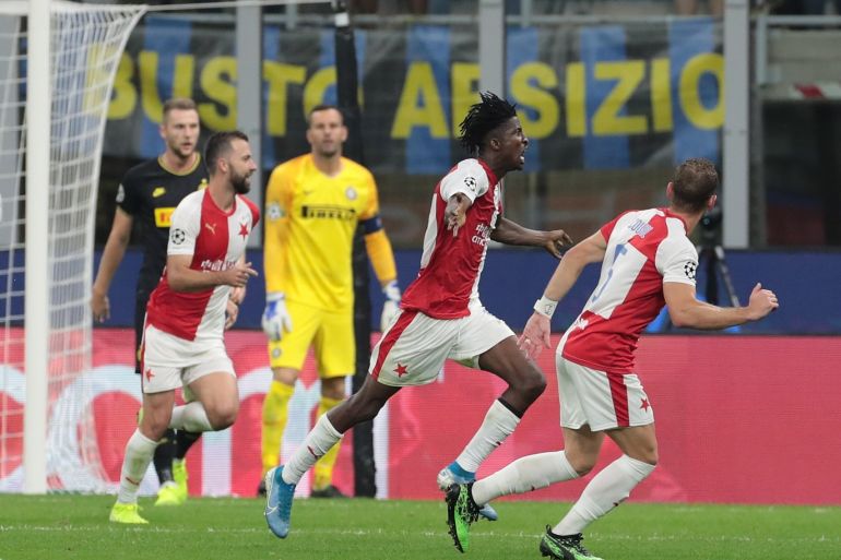 MILAN, ITALY - SEPTEMBER 17: Peter Olayinka of SK Slavia Praha celebrates with his team-mates after scoring the opening goal during the UEFA Champions League group F match between FC Internazionale and Slavia Praha at Giuseppe Meazza Stadium on September 17, 2019 in Milan, Italy. (Photo by Emilio Andreoli/Getty Images)