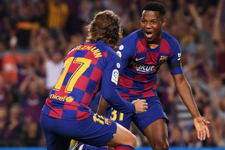 BARCELONA, SPAIN - SEPTEMBER 14: Anssumane Fati of Barcelona celebrates after scoring his team's first goal with Antoine Griezmann during the Liga match between FC Barcelona and Valencia CF at Camp Nou on September 14, 2019 in Barcelona, Spain. (Photo by Alex Caparros/Getty Images)