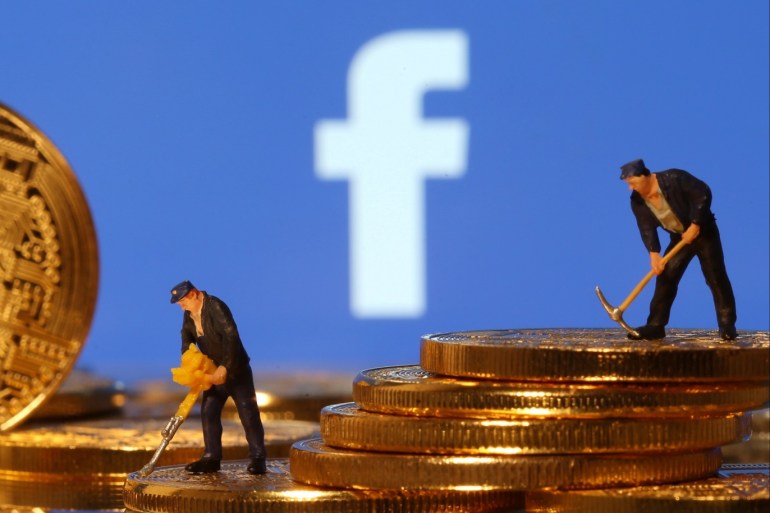 Small toy figures stand on representations of virtual currency in front of the Facebook logo in this illustration picture, June 21, 2019. REUTERS/Dado Ruvic/Illustration