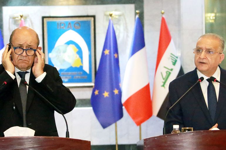 epa07926742 French Foreign Minister Jean-Yves Le Drian and Iraqi Foreign Minister Mohamad Ali Alhakim (R) give a joint press conference at the Iraqi Ministry of Foreign Affairs in Baghdad, Iraq, 17 October 2019. Le Drian is in Iraq for talks with senior Iraqi officials on the ongoing Turkish offensive in northeast Syria as well as to agree a judicial mechanism for putting French IS detainees on trial in Iraq. EPA-EFE/AHMED JALIL