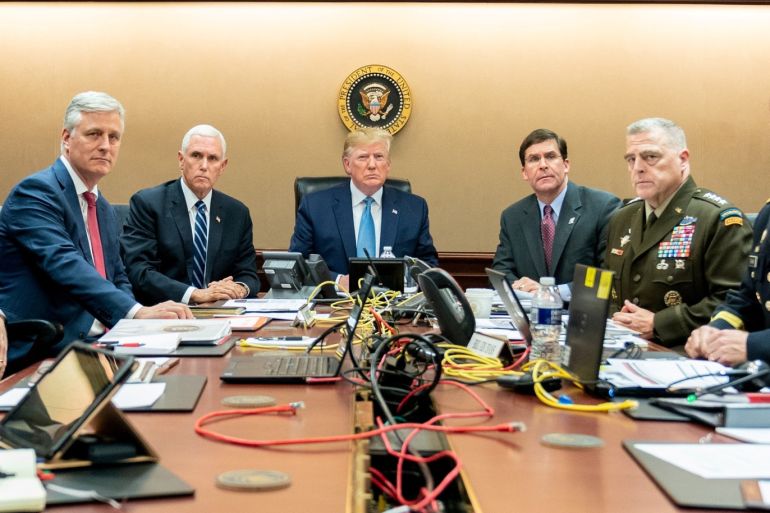 U.S. President Donald Trump, U.S. Vice President Mike Pence (2nd L), U.S. Secretary of Defense Mark Esper (3rd R), along with members of the national security team, watch as U.S. Special Operations forces close in on ISIS leader Abu Bakr al-Baghdadi, in the Situation Room of the White House in Washington, U.S., October 26, 2019. Picture taken October 26, 2019. Shealah Craighead/The White House/Handout via REUTERS THIS IMAGE HAS BEEN SUPPLIED BY A THIRD PARTY. TPX