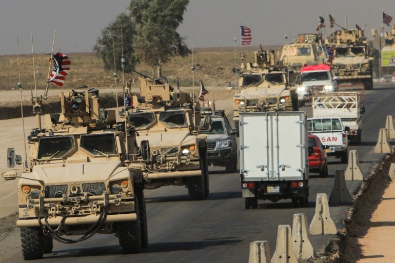 A convoy of U.S. vehicles is seen after withdrawing from northern Syria, on the outskirts of Dohuk, Iraq, October 21, 2019. REUTERS/Ari Jalal