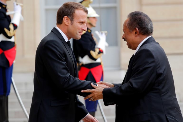 French President Emmanuel Macron welcomes Sudan's Prime Minister Abdalla Hamdok as he arrives for a meeting at the Elysee Palace in Paris, France, September 30, 2019. REUTERS/Philippe Wojazer