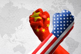 USA and China flag print screen on arm wrestle with world map background.United States of America versus China trade war disputes concept. - Image