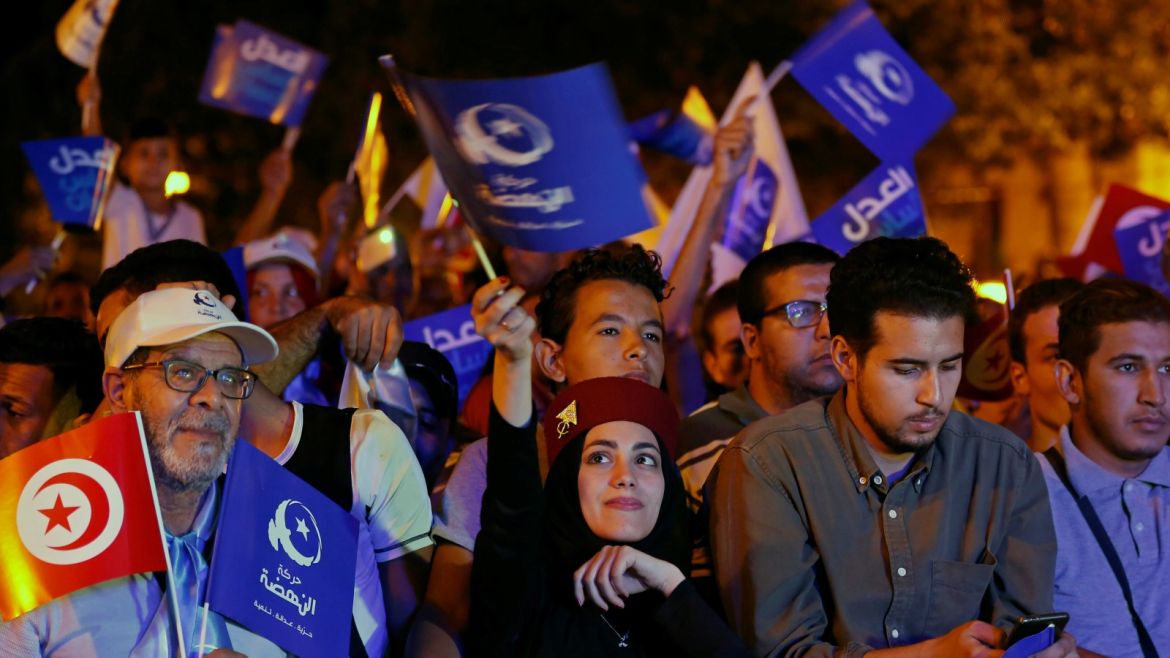 Supporters of Tunisia's moderate Islamist Ennahda party carry flags during a campaign event ahead of the parliamentary elections in Tunis, Tunisia October 3, 2019. Picture taken October 3, 2019. REUTERS/Zoubeir Souissi