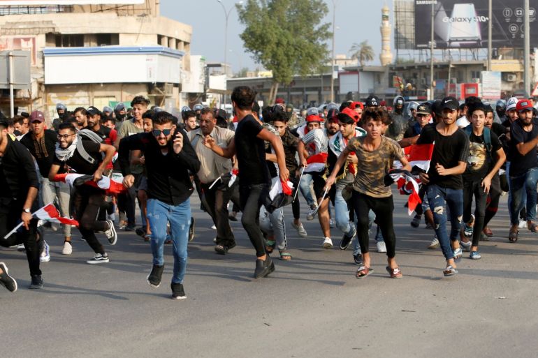Demonstrators run as they take part in a protest over unemployment, corruption and poor public services, in Basra, Iraq October 2, 2019. REUTERS/Essam al-Sudani