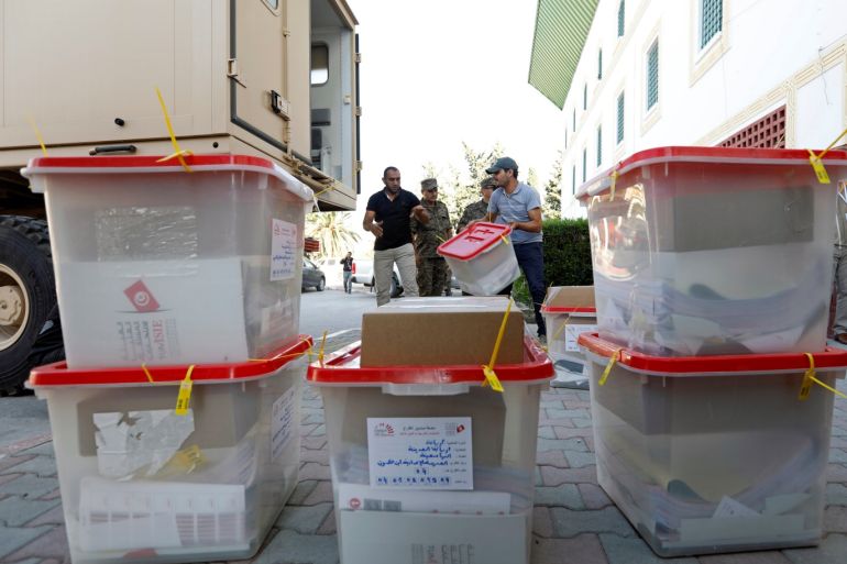 Soldiers stand guard as polling agents transport ballot boxes and election material to be distributed to polling stations, ahead of the Sunday's parliamentary election in Tunis, Tunisia October 5, 2019. REUTERS/Zoubeir Souissi