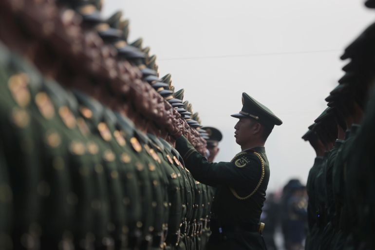 Paramilitary police officers prepare before the military parade marking the 70th founding anniversary of People's Republic of China, on its National Day in Beijing, China October 1, 2019. Han Haidan/CNS via REUTERS ATTENTION EDITORS - THIS IMAGE WAS PROVIDED BY A THIRD PARTY. CHINA OUT.
