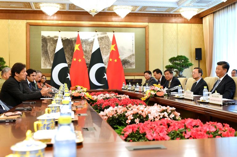 Pakistan's Prime Minister Imran Khan talks to China's President Xi Jinping during their meeting at the Diaoyutai State Guesthouse in Beijing, China, October 9, 2019. Parker Song/Pool via REUTERS