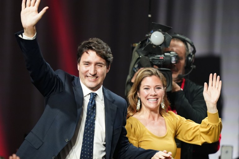 Liberal leader and Canadian Prime Minister Justin Trudeau and his wife Sophie Gregoire Trudeau wave to supporters after the federal election at the Palais des Congres in Montreal, Quebec, Canada October 22, 2019. REUTERS/Carlo Allegri